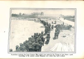 Page 80: Australians studying the large contour map which was made for the Troops to give them a good knowledge if the country around Messines over which they had to attack.