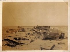 the remains of a German tank and an armoured fighting vehicle