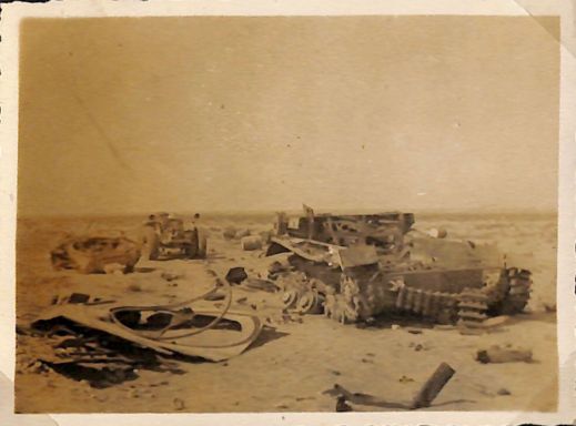 the remains of a German tank and an armoured fighting vehicle