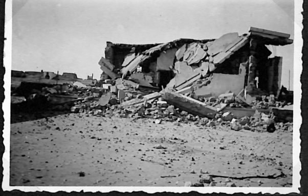 a building on the Bardia Road after aerial bombing