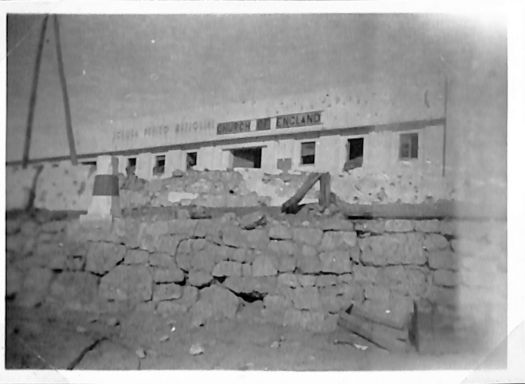 a curch in Tobruk scarred from bombing and flying shrapnel