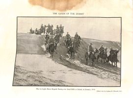 The 1st Light Horse Brigade passing over sand hills at Esdud, in January, 1918.